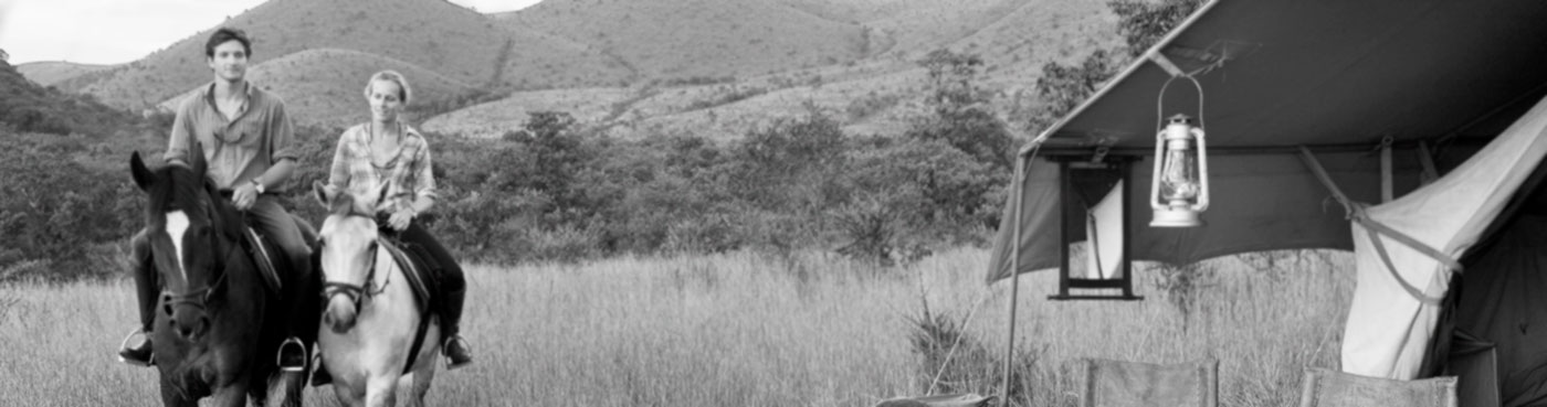 Couple on a horse riding safari in the Chyulu Hills