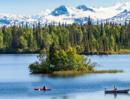 Kayakers and snowy peaks near Winterlake Lodge, Alaska with GeoEx