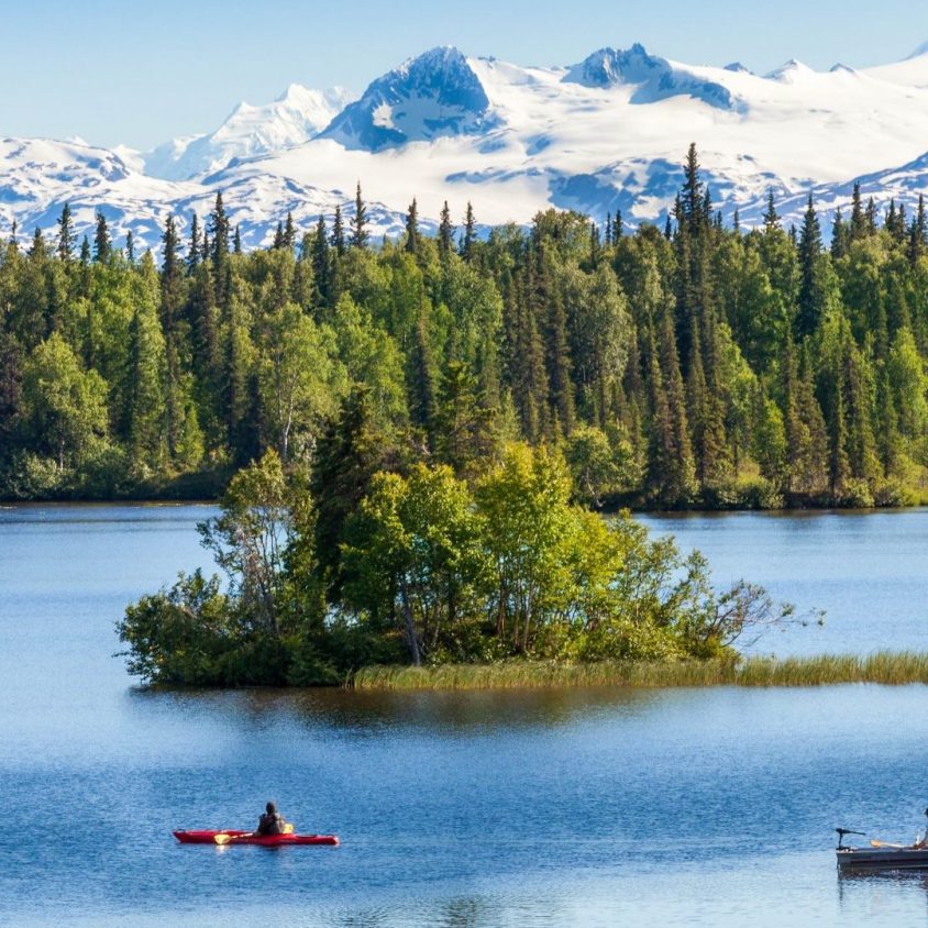 Kayakers and snowy peaks near Winterlake Lodge, Alaska with GeoEx