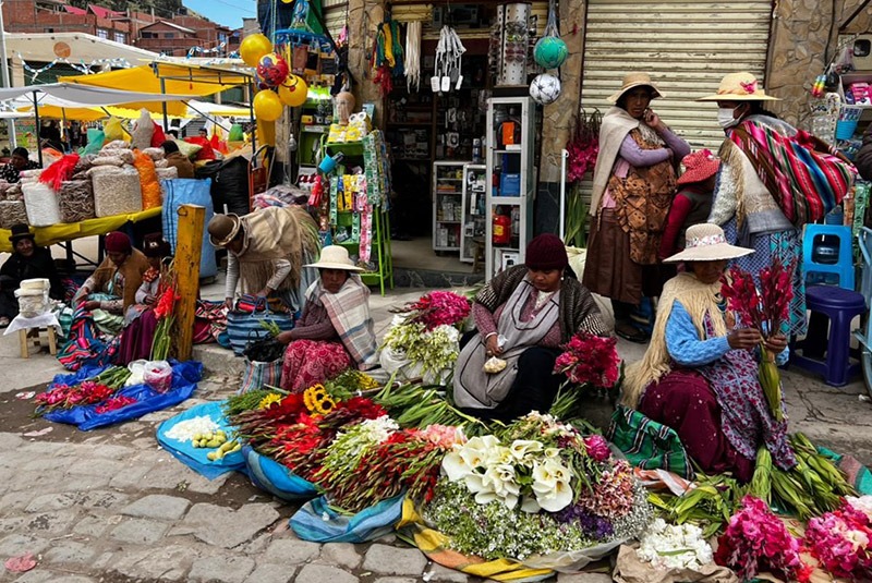 Flower sellers at a market in Copacabana, Bolivia