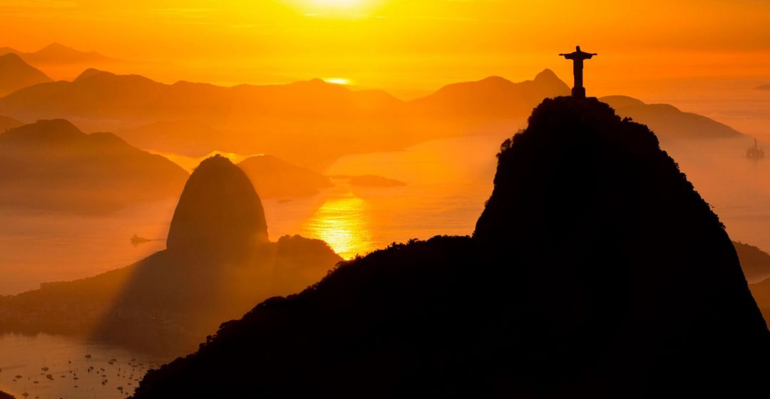 Rio de Janeiro landmarks: Christ the Redeemer and Sugar Loaf in the mist at sunrise, Brazil