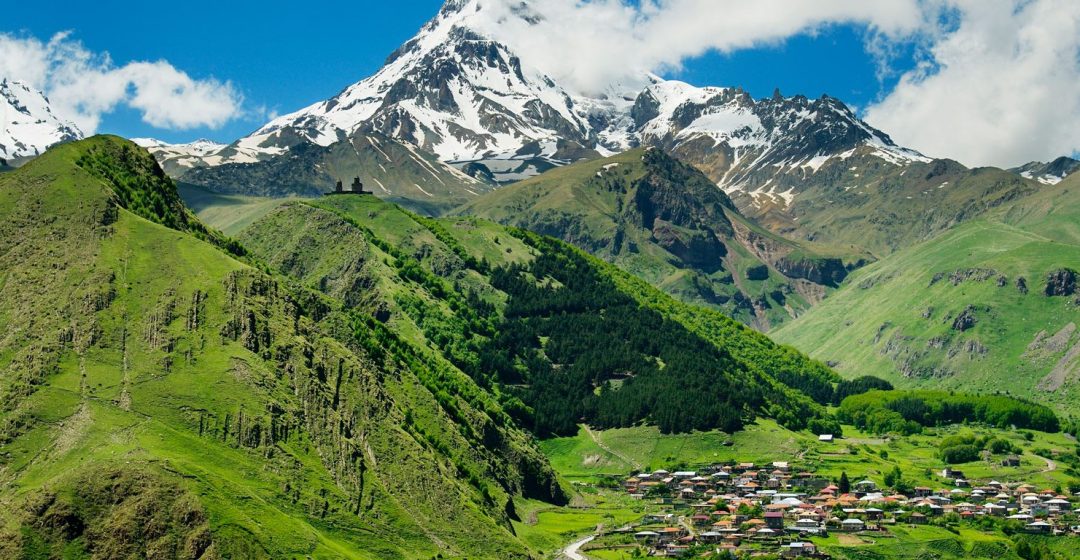 Mount Kazbek and the village of Stepantsminda in Georgia, Caucasus