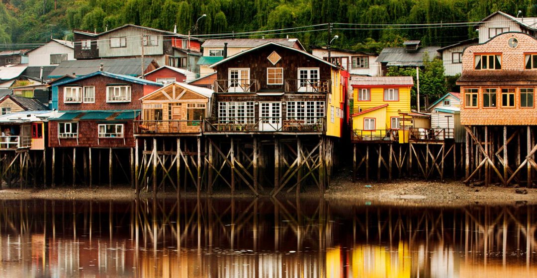 Palafito stilt houses in the tidal bay at Chiloe, Patagonia, Chile