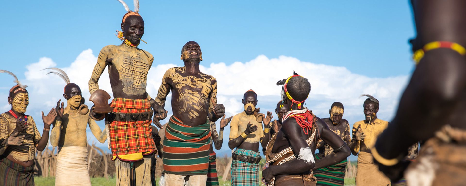 Members of the Kara tribe jumping and dancing, Omo Valley, Ethiopia