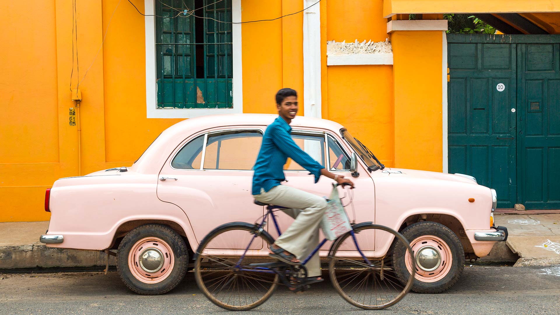 Cyclist and Ambassador car in Pondicherry, India