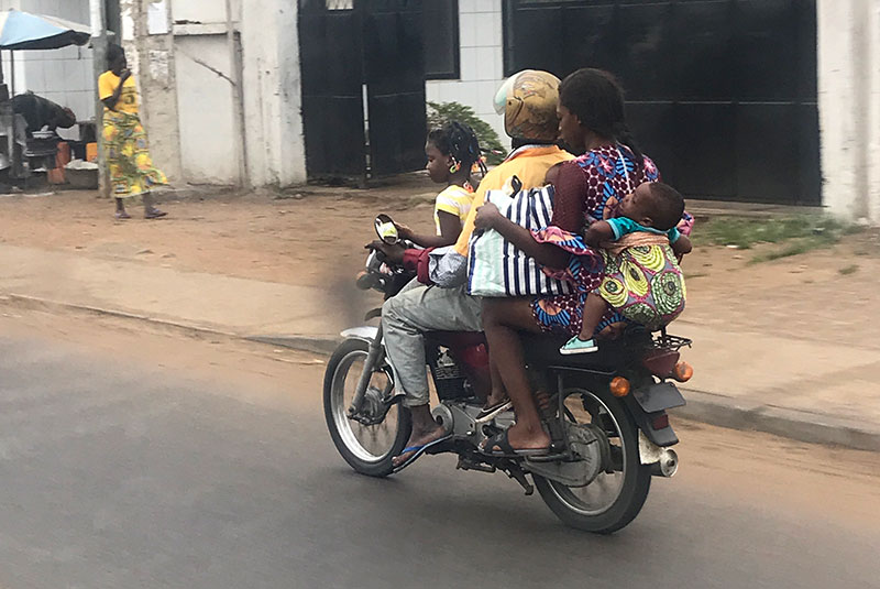 Family on a motorbike in Cotonou, Benin