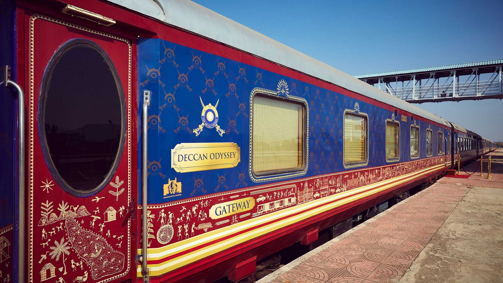 The Deccan Odyssey train at a station platform in India with GeoEx