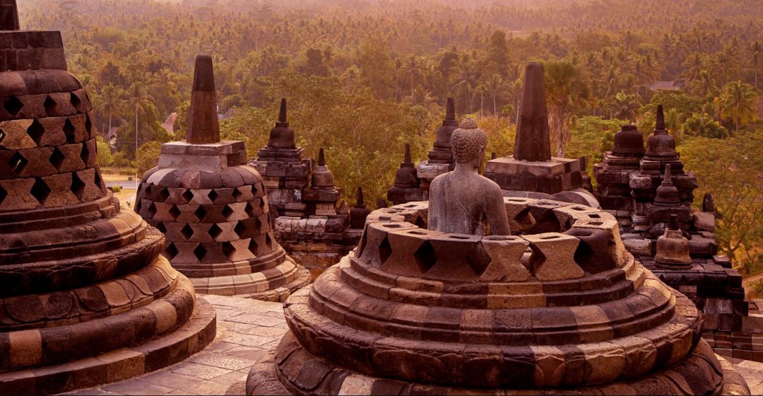 Statue and stupas at Borobudur Temple on Java, Indonesia