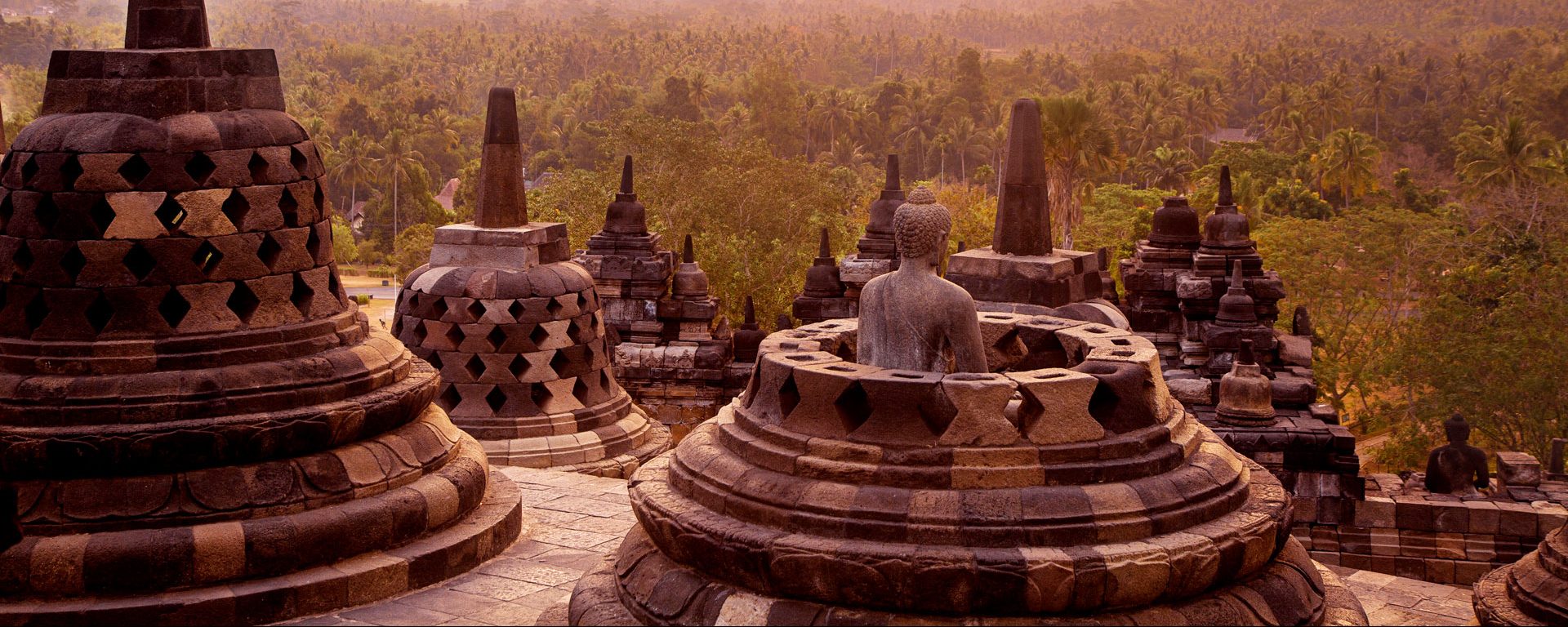 Statue and stupas at Borobudur Temple on Java, Indonesia