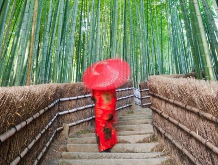 Woman walking through Arashiyama Bamboo Forest in Kyoto, Japan with GeoEx