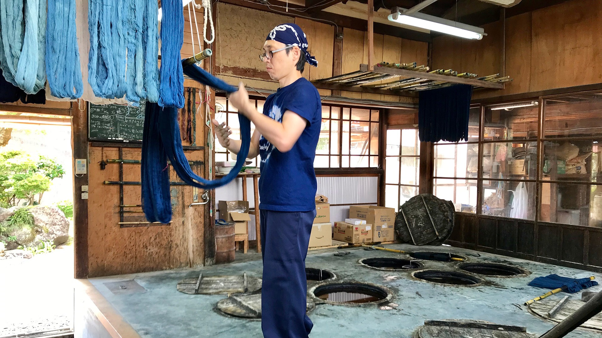 Fifth generation indigo dyeing artist in his workshop in Matsue, Japan