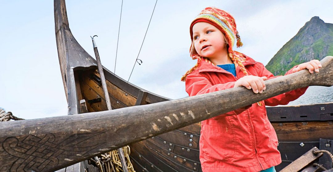 Girl at the oar of a vikingship, Viking museum, Borg, Lofoten, Norway