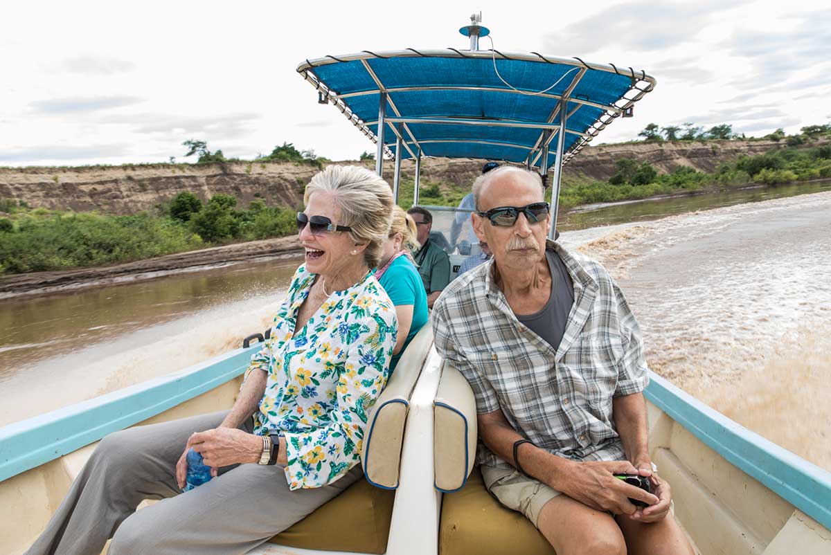 GeoEx travelers on a boat expedition on the Omo River.