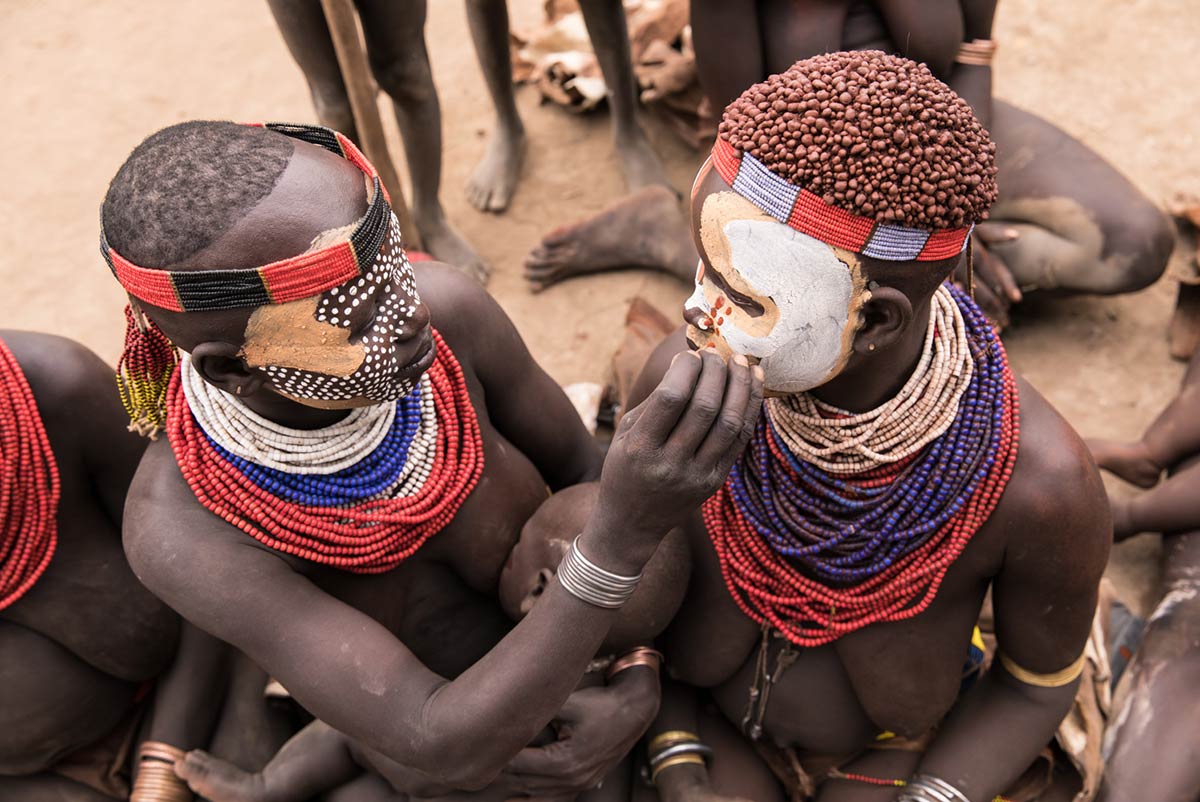 Kara women during body paint ceremony, Omo Valley, Ethiopia