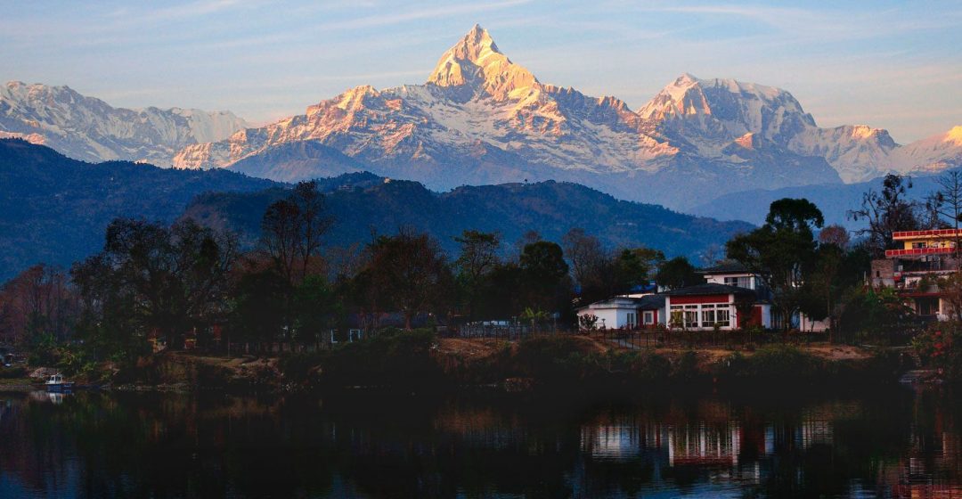 Reflections of the Annapurna Range in Phewa Lake at sunset, Pokhara, Nepal