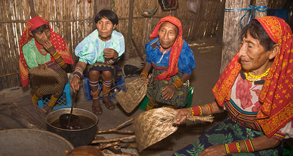 Kuna women sitting inside local house, San Blas Islands, Panama.