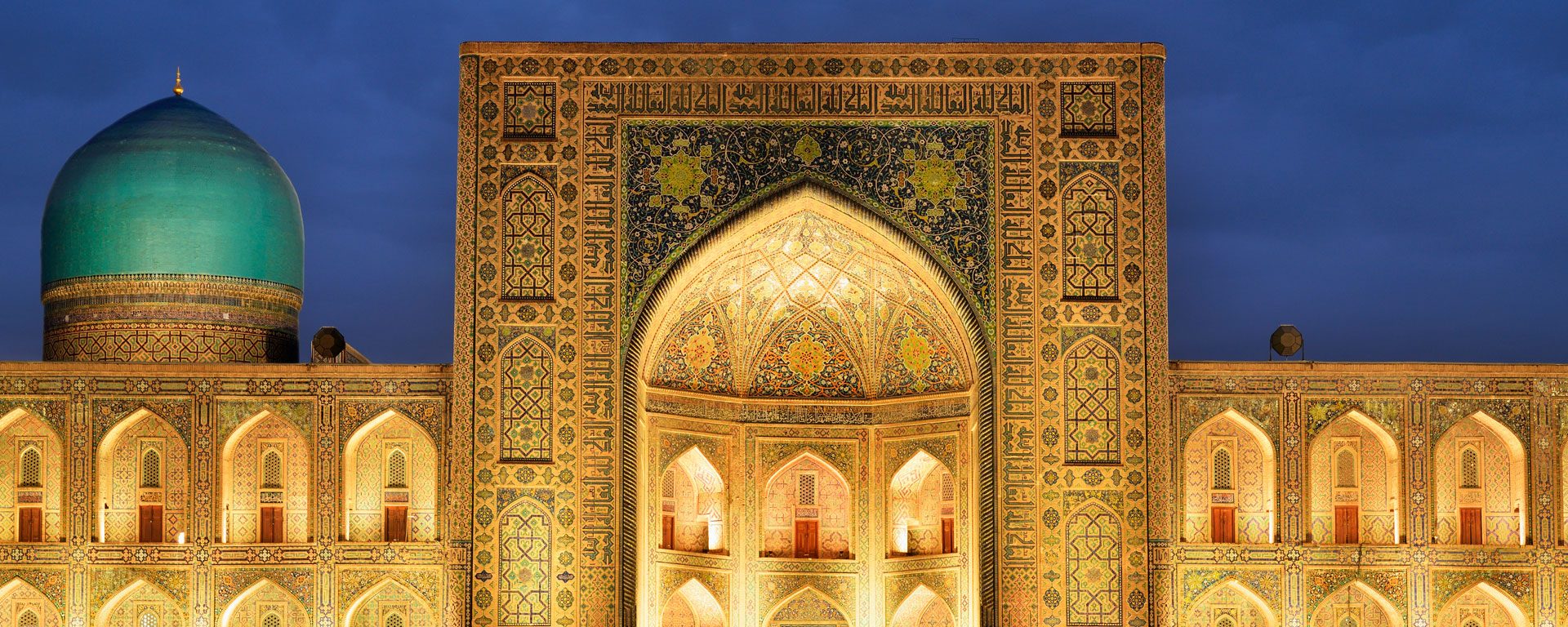 The Registan Square lit up in the evening in Samarkand, Uzbekistan