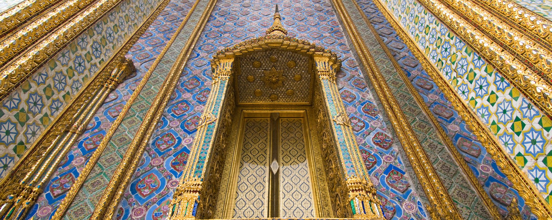 Detail of window and columns of Wat Phra Kaew in the Royal Palace complex in Bangkok, Thailand