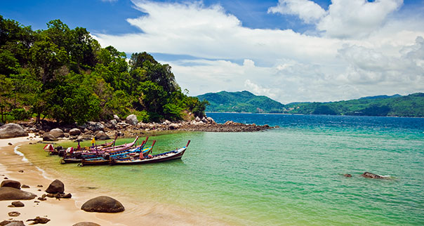 Longtail boats and bay scene in Phuket, Thailand