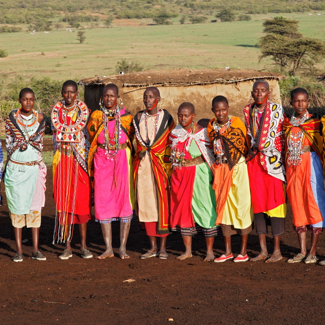 Colorfully dressed Maasai women in village, Kenya