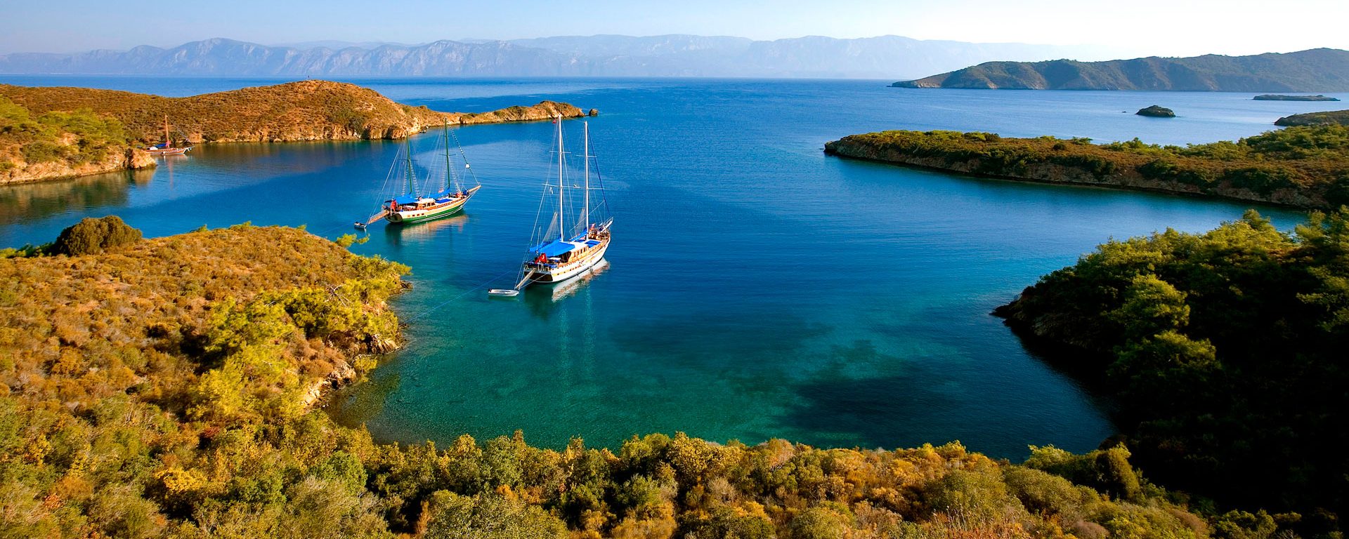 A gulet (traditional Turkish sailing boat) mooring at Tuzla Bay on the Aegean coast, Turkey